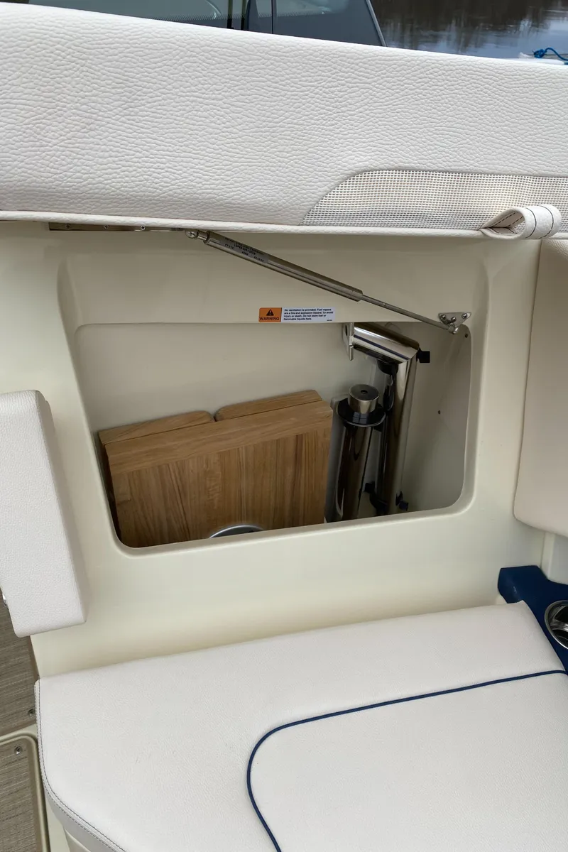 Slide: The Image of 2024 Chris-Craft Calypso 32 boat interior with white and blue seating. - 20