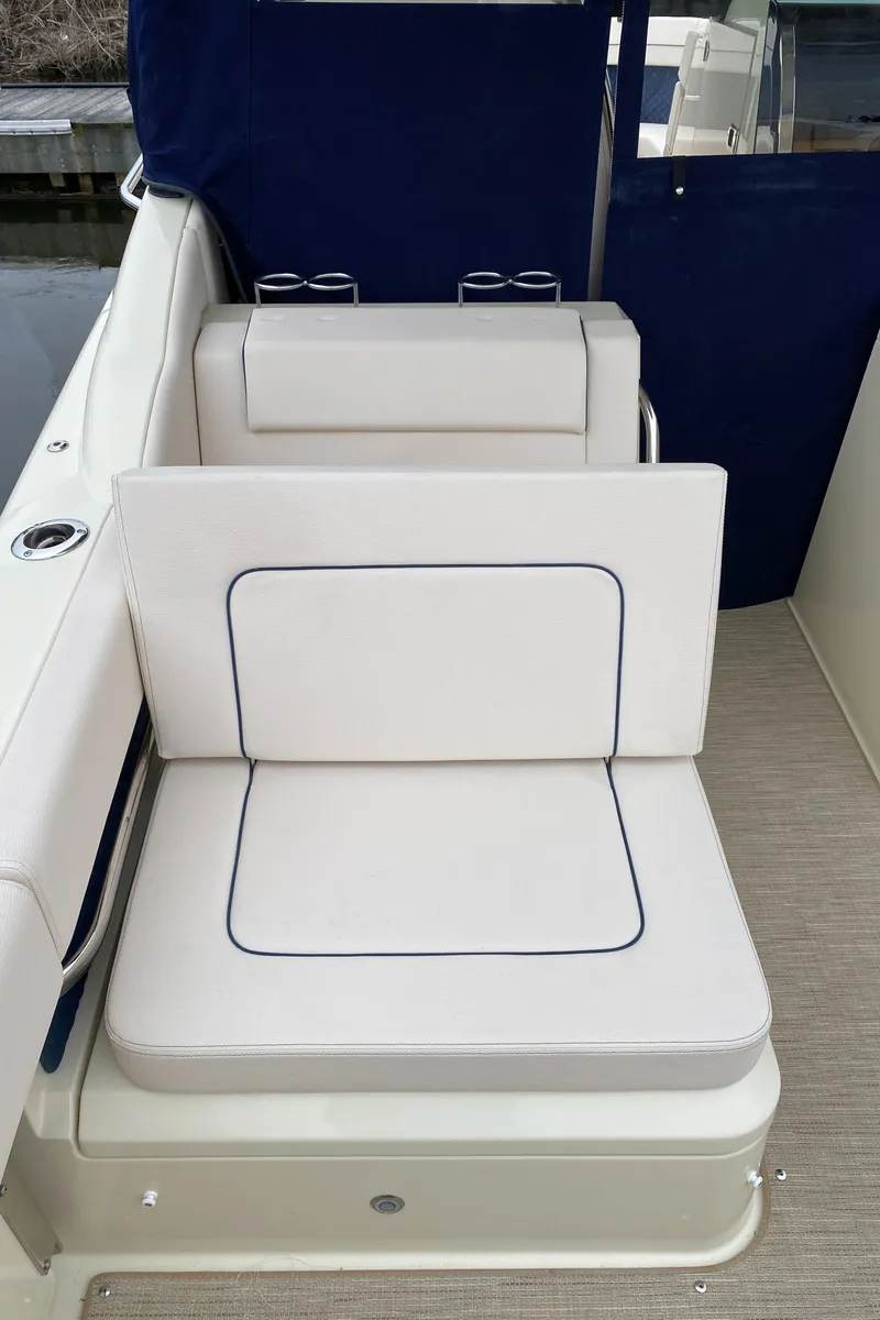 Slide: The Image of 2024 Chris-Craft Calypso 32 boat interior seating area. - 8