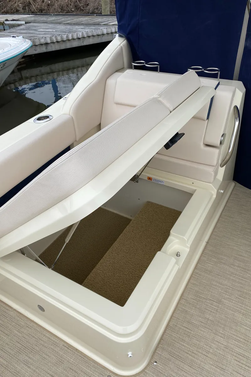 Slide: The Image of 2024 Chris-Craft Calypso 32 boat with white cushioned seating. - 9