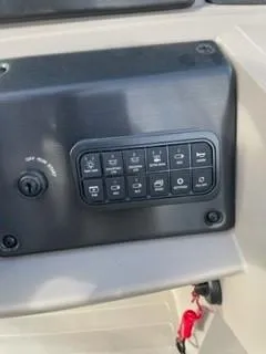 Slide: The Image of Control panel of 2024 Sun Tracker Fishin' Barge 20 DLX boat. - 13