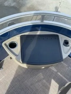 Slide: The Image of 2024 Sun Tracker Fishin' Barge 20 DLX fishing station with cup holders. - 14