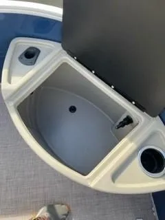 Slide: The Image of Open storage compartment on 2024 Sun Tracker Fishin' Barge 20 DLX. - 15