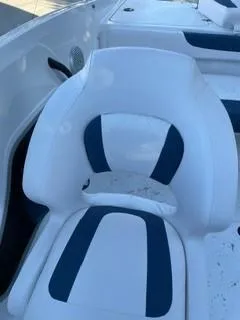 Slide: The Image of 2024 Tahoe 185 S boat with white and blue cushioned seating. - 11