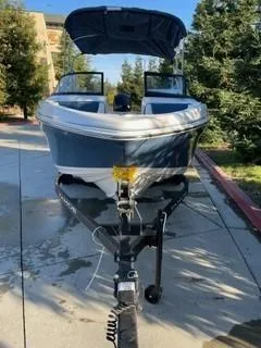 Slide: The Image of 2024 Tahoe 185 S boat on trailer, parked outdoors. - 3