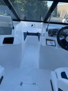 Slide: The Image of 2024 Tahoe 185 S boat interior with steering wheel and dashboard. - 9