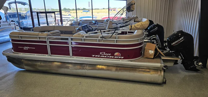 Slide: The Image of 2024 Sun Tracker Party Barge 20 DLX pontoon boat in showroom. - 21