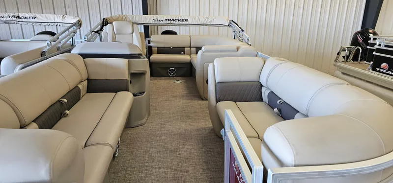 Slide: The Image of 2024 Sun Tracker Party Barge 20 DLX interior with spacious seating and modern design. - 4