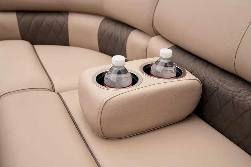 Slide: The Image of Sun Tracker SportFish 22 DLX 2024 boat interior with cup holders and water bottles. - 26