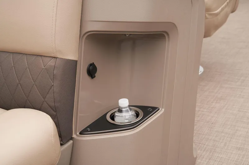Slide: The Image of 2024 Sun Tracker SportFish 22 DLX cup holder and storage compartment. - 29