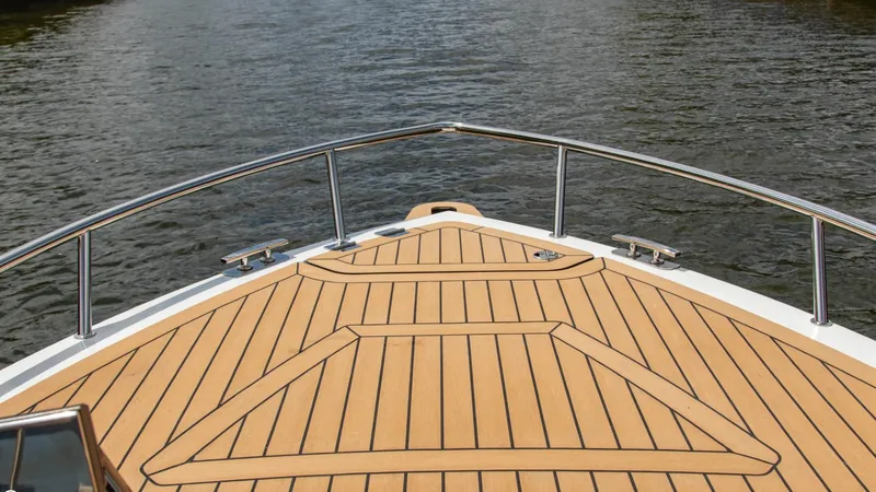 Slide: The Image of Bow deck of 2023 Alfastreet 23 Cabin Electric boat on water. - 10
