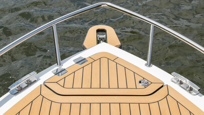 Slide: The Image of Bow of 2023 Alfastreet 23 Cabin Electric boat with teak decking. - 11