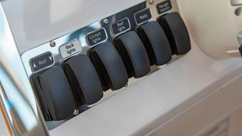 Slide: The Image of Control panel of 2023 Alfastreet 23 Cabin Electric boat with labeled switches. - 15