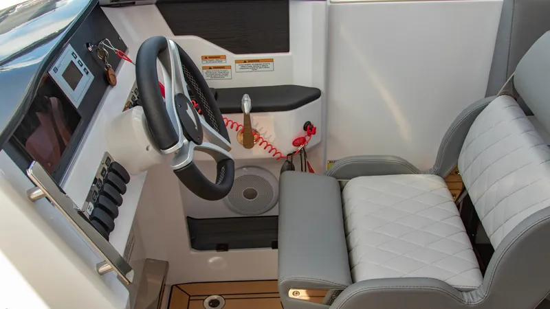 Slide: The Image of Interior cockpit of 2023 Alfastreet 23 Cabin Electric boat with steering wheel and seating. - 16