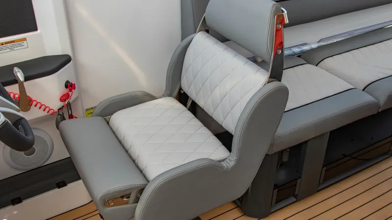 Slide: The Image of 2023 Alfastreet 23 Cabin Electric boat interior with grey and white cushioned seating. - 17