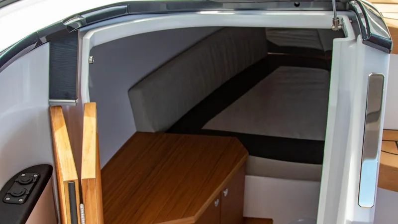 Slide: The Image of Interior cabin of 2023 Alfastreet 23 Cabin Electric boat with wooden furnishings. - 19