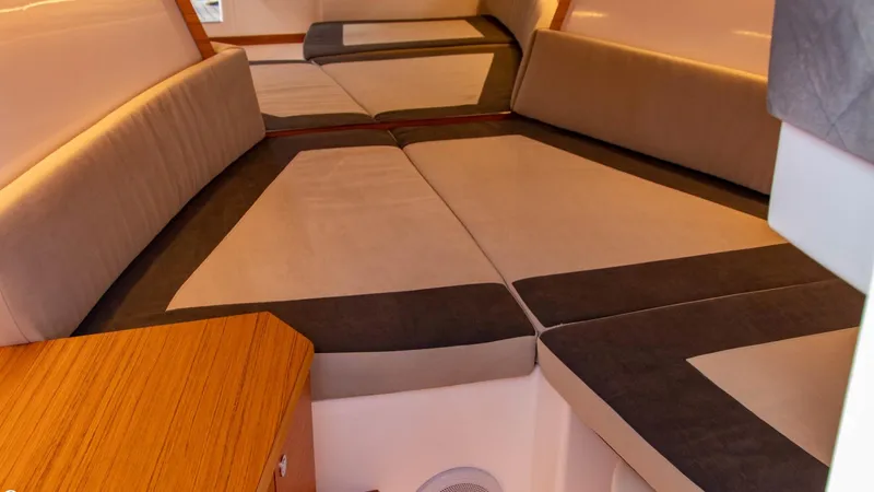 Slide: The Image of Interior of 2023 Alfastreet 23 Cabin Electric boat with cushioned seating. - 26