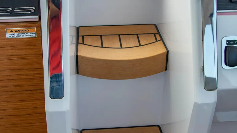 Slide: The Image of Steps inside the 2023 Alfastreet 23 Cabin Electric boat with wooden finish. - 31