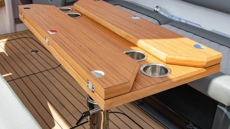 Slide: The Image of Wooden table with cup holders on Alfastreet 23 Cabin Electric boat, 2023 model. - 42