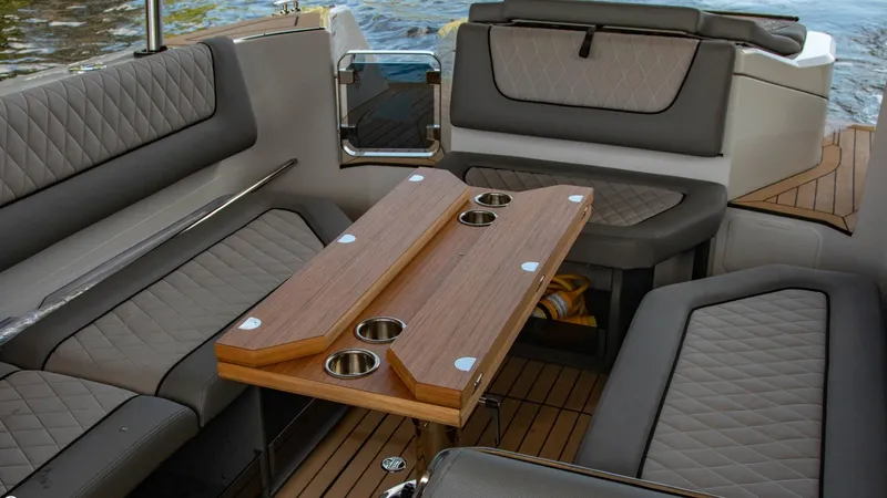 Slide: The Image of Interior of 2023 Alfastreet 23 Cabin Electric boat with seating and wooden table. - 46