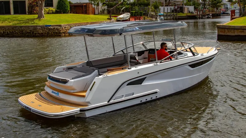 Slide: The Image of 2023 Alfastreet 23 Cabin Electric boat cruising on a calm river. - 6