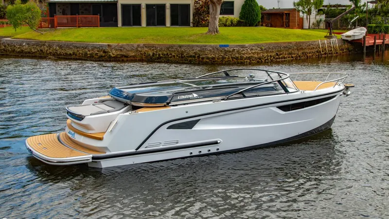Slide: The Image of 2023 Alfastreet 23 Cabin Electric boat on a calm river. - 7