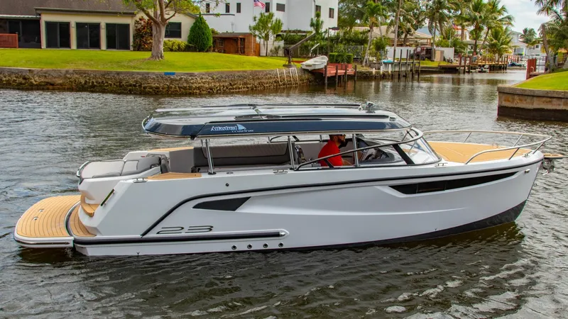 Slide: The Image of 2023 Alfastreet 23 Cabin Electric boat cruising on a scenic waterway. - 8