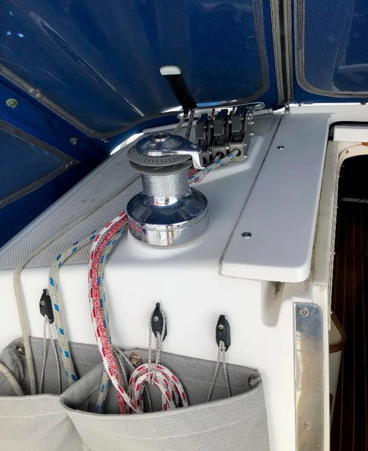 Slide: The Image of Deck view of a 1998 Catalina 320 yacht with winch and ropes. - 11
