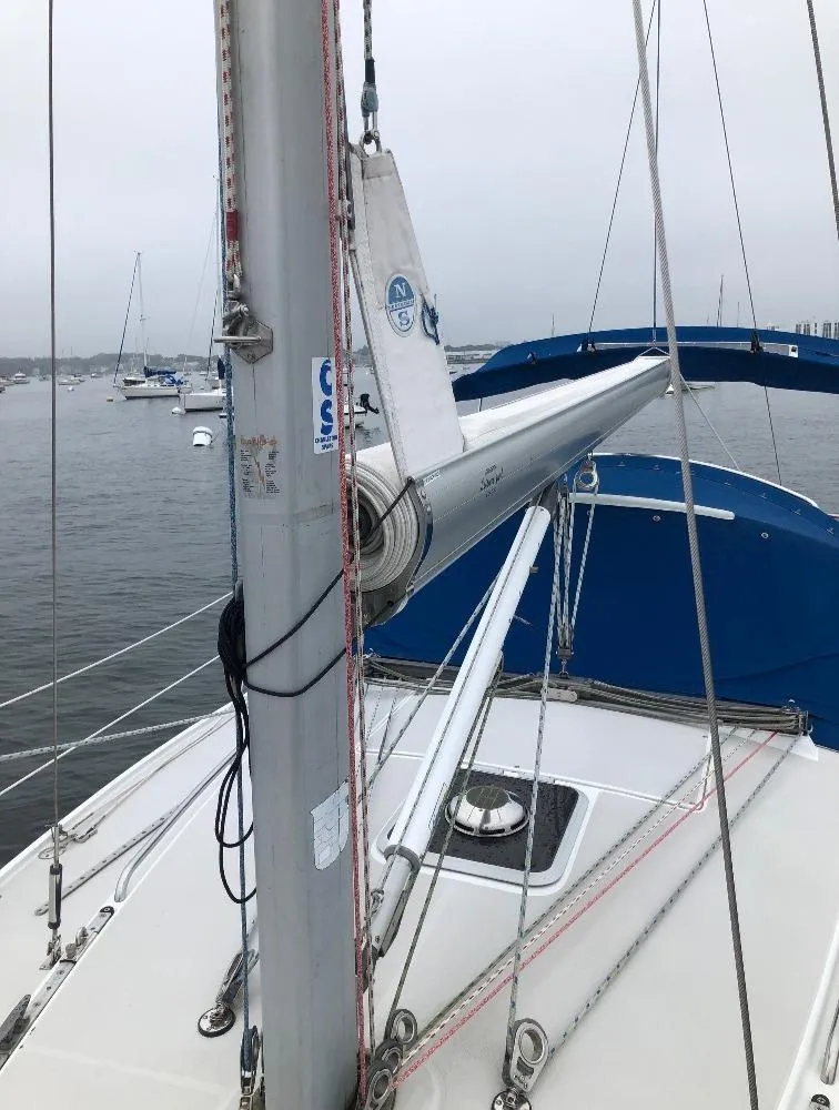 Slide: The Image of 1998 Catalina 320 sailboat on calm waters. - 13