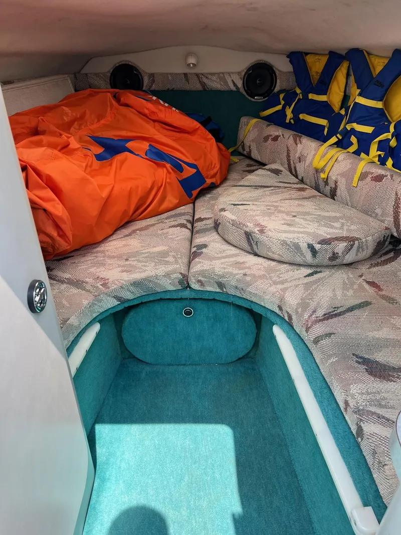 Slide: The Image of 1993 Chris-Craft 238 Concept cabin interior with life jackets and bedding. - 16