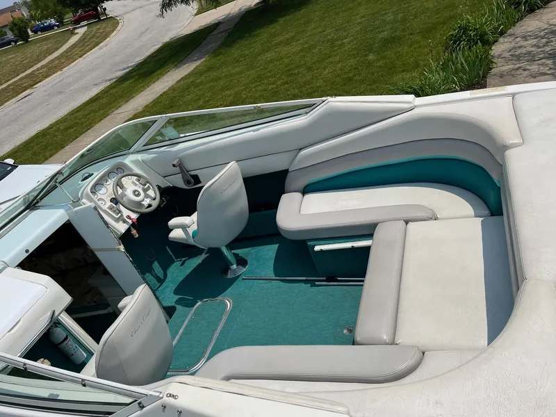 Slide: The Image of 1993 Chris-Craft 238 Concept boat interior with white and teal seating. - 19