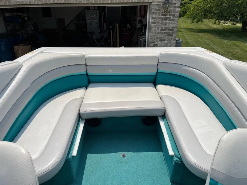Slide: The Image of 1993 Chris-Craft 238 Concept boat interior with white and teal seating. - 20