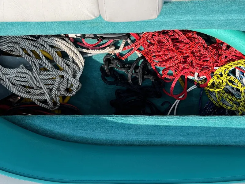 Slide: The Image of Storage compartment with ropes on a 1993 Chris-Craft 238 Concept boat. - 6