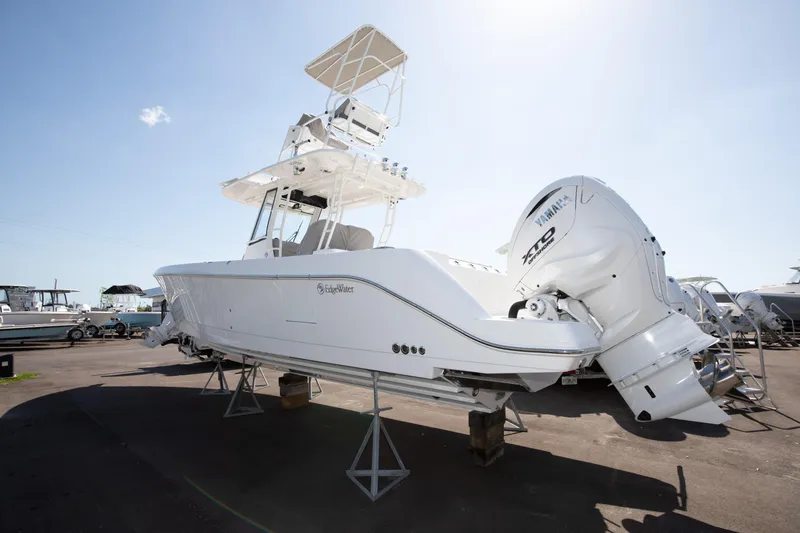 Slide: The Image of 2024 Edgewater 340CC boat on display with twin Yamaha engines. - 15