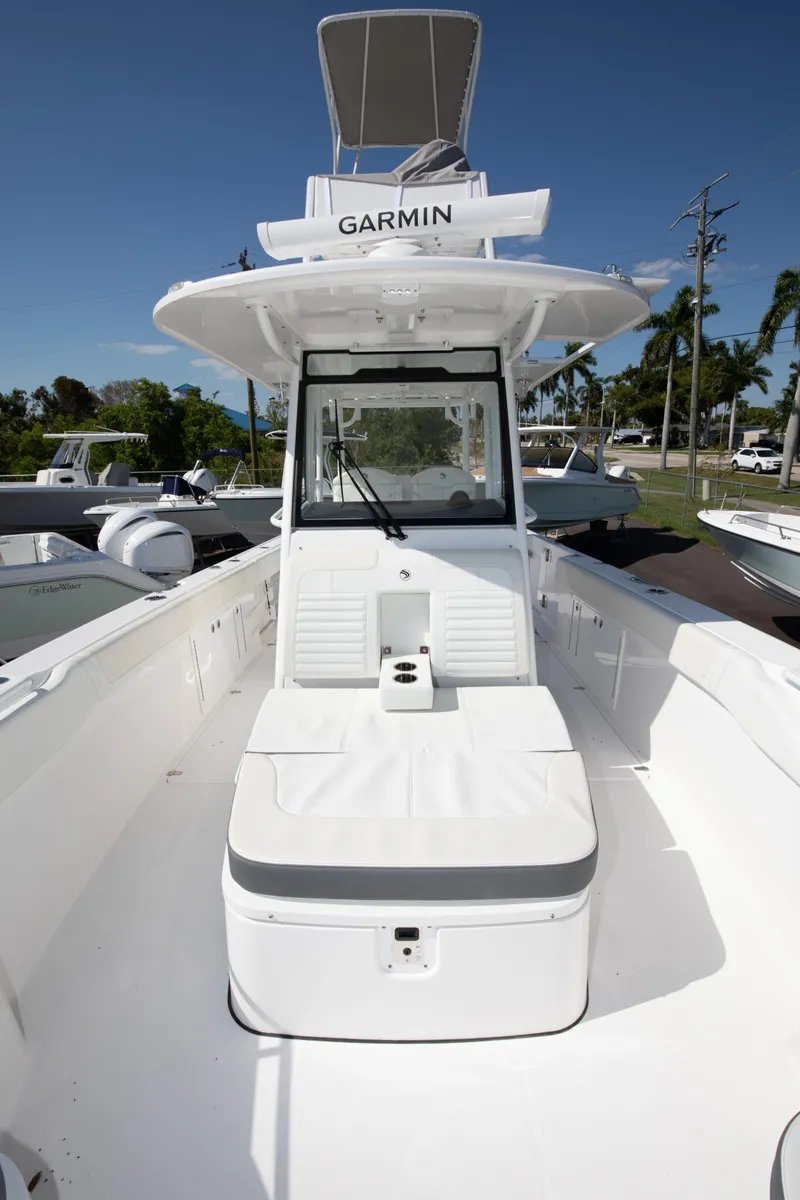 Slide: The Image of 2024 Edgewater 340CC center console boat with Garmin navigation system. - 16