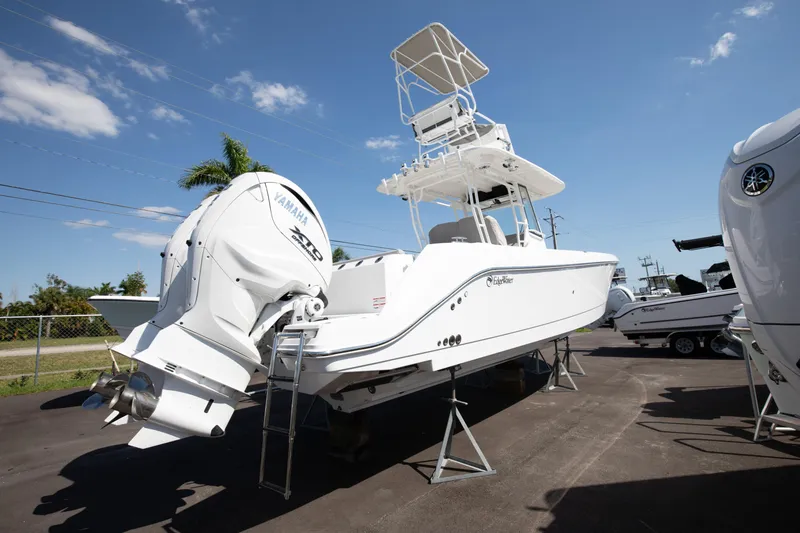 Slide: The Image of 2024 Edgewater 340CC boat with dual Yamaha engines on display. - 21