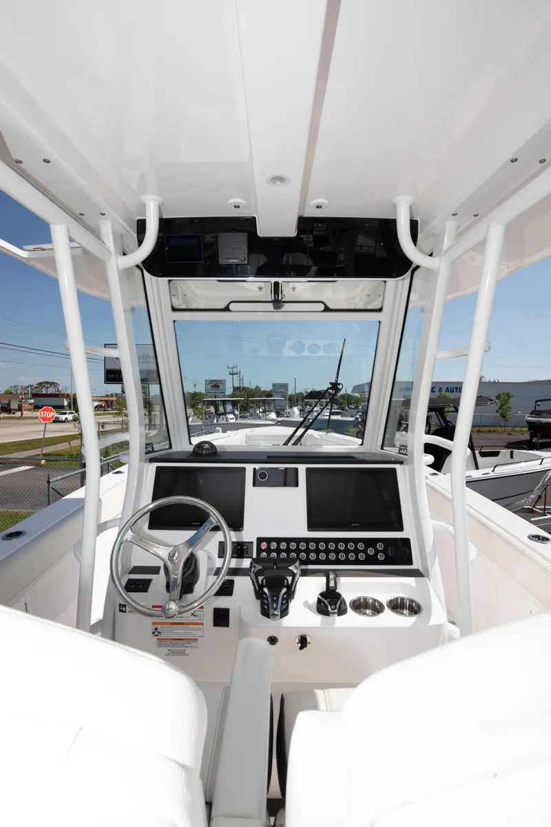 Slide: The Image of 2024 Edgewater 340CC boat cockpit with modern controls and navigation system. - 25