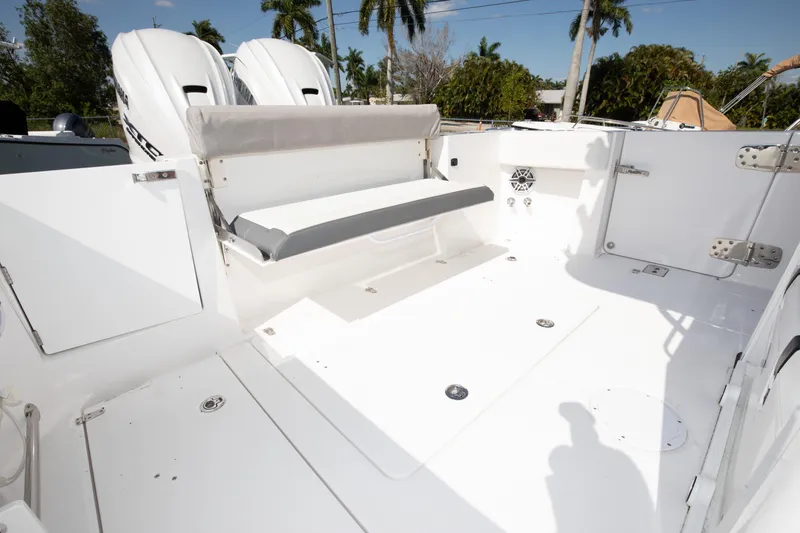 Slide: The Image of 2024 Edgewater 340CC boat deck with seating and twin engines. - 32