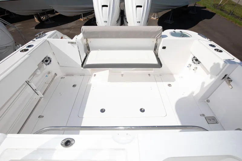 Slide: The Image of 2024 Edgewater 340CC boat interior with spacious deck and seating. - 33