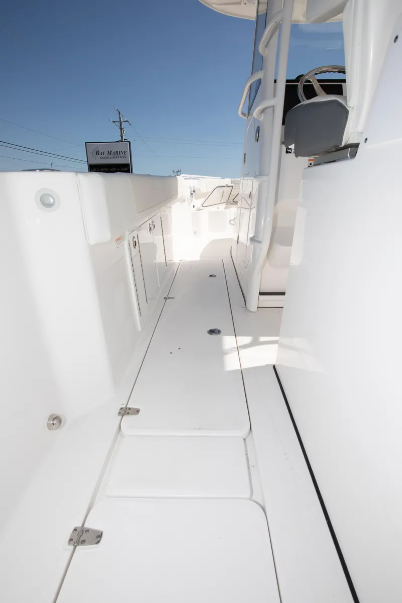 Slide: The Image of 2024 Edgewater 340CC boat deck with white finish and modern design. - 35