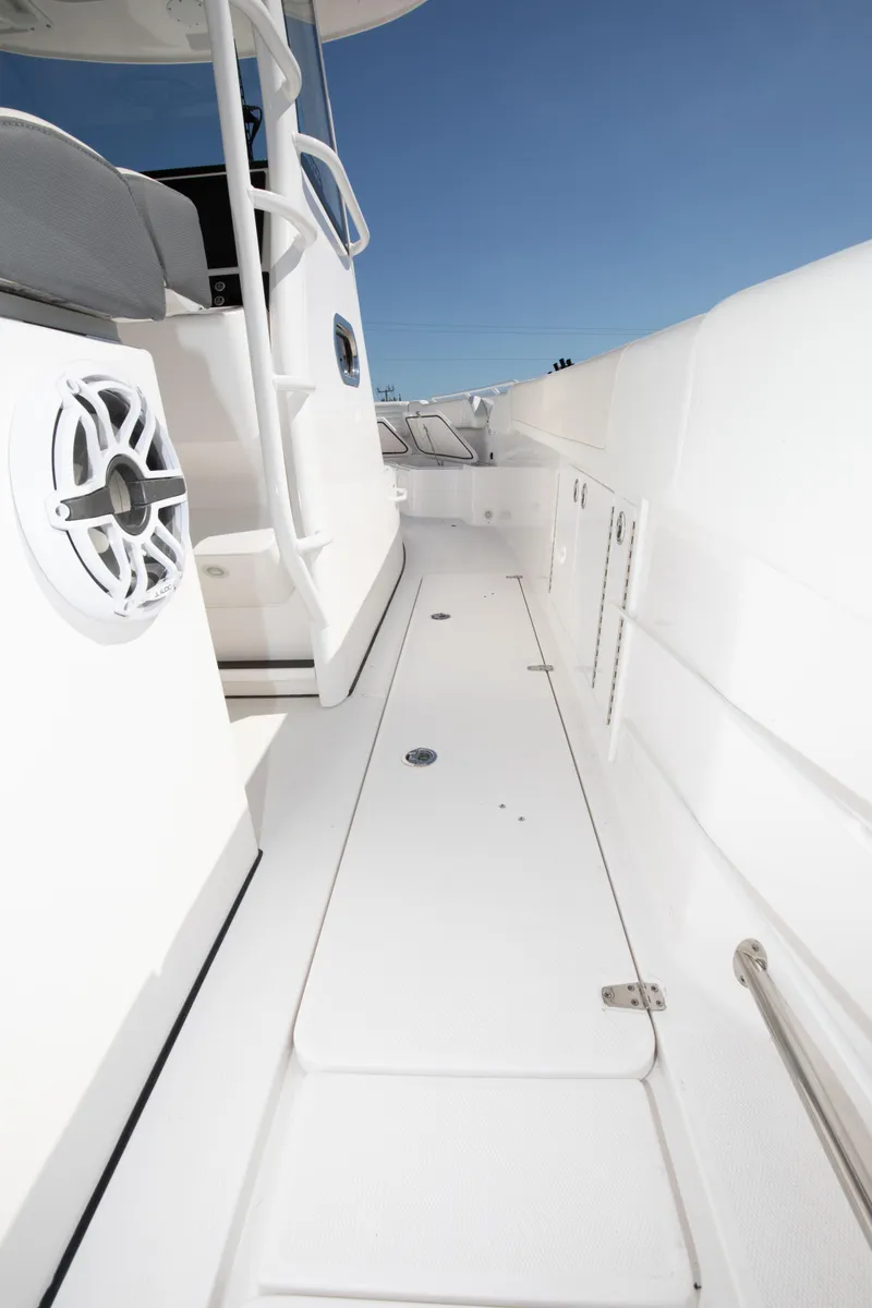 Slide: The Image of 2024 Edgewater 340CC boat deck with white seating and speaker. - 36