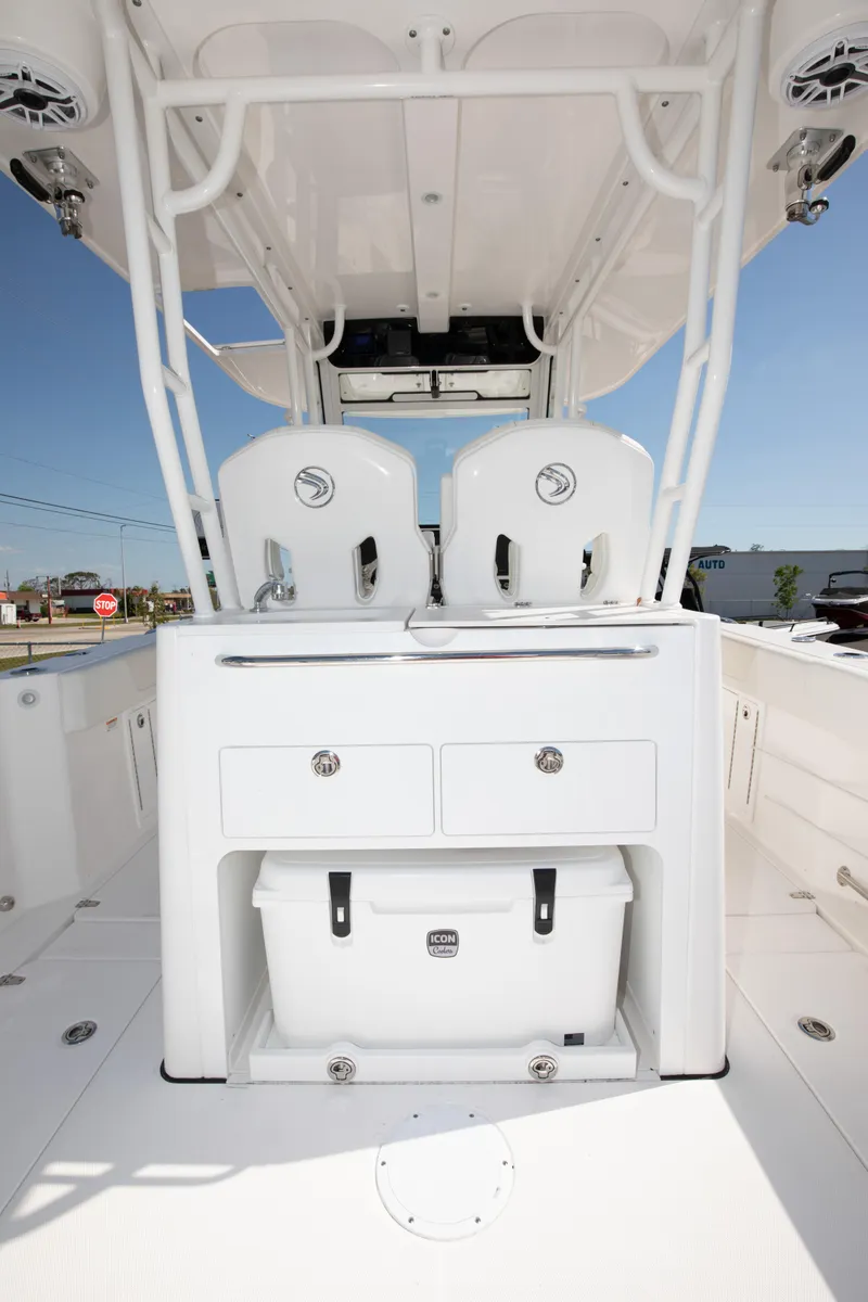 Slide: The Image of 2024 Edgewater 340CC center console boat interior with storage compartments. - 8