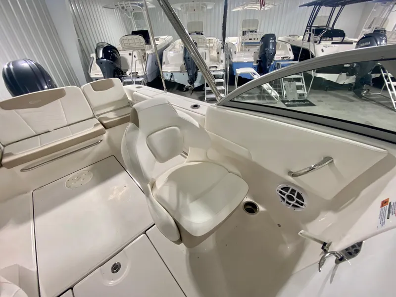 Slide: The Image of 2024 Robalo R207 Dual Console boat interior with seating and storage. - 14