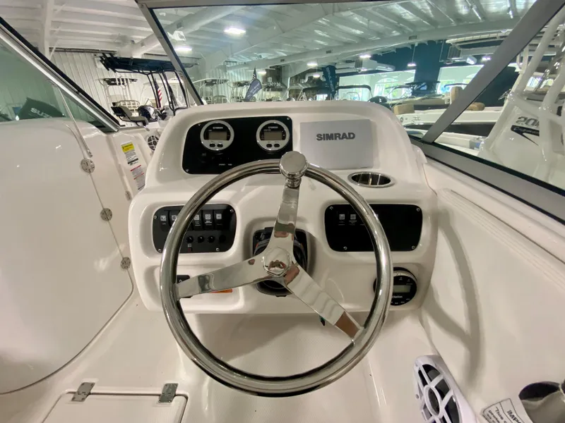 Slide: The Image of 2024 Robalo R207 Dual Console boat helm with Simrad electronics. - 22