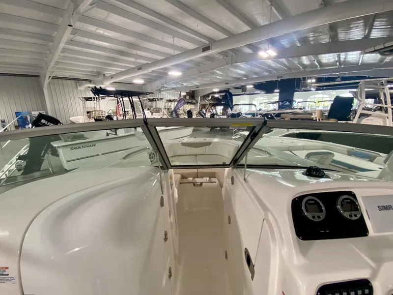 Slide: The Image of 2024 Robalo R207 Dual Console boat interior in showroom. - 23