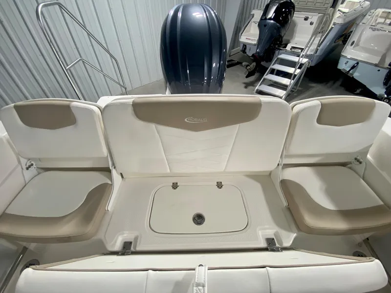 Slide: The Image of 2024 Robalo R207 Dual Console boat interior with seating and outboard motor. - 7