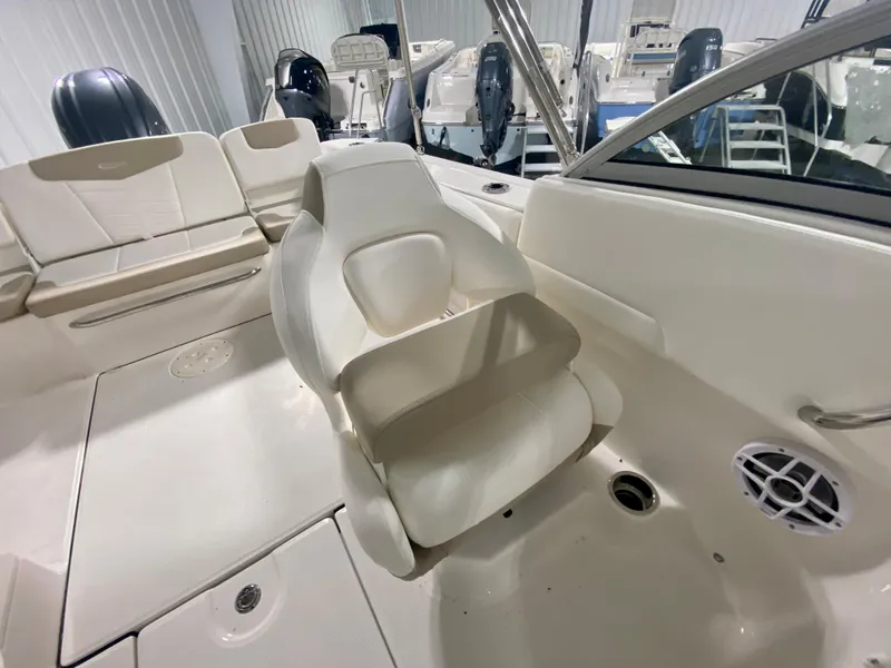 Slide: The Image of 2024 Robalo R207 Dual Console boat interior with seating and console. - 19