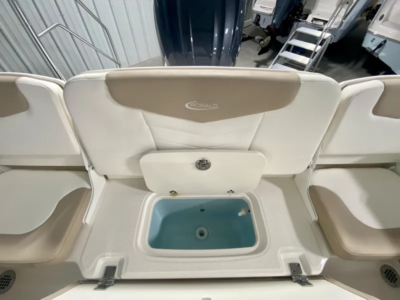 Slide: The Image of 2024 Robalo R207 Dual Console boat interior with seating and storage. - 9