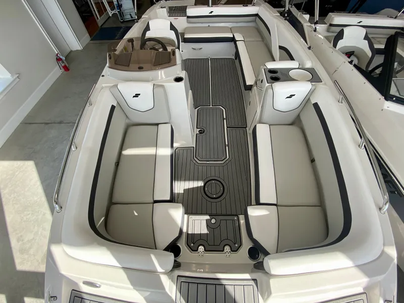 Slide: The Image of 2024 Starcraft SVX 211 Electric Blue Sport boat interior with spacious seating and modern design. - 26