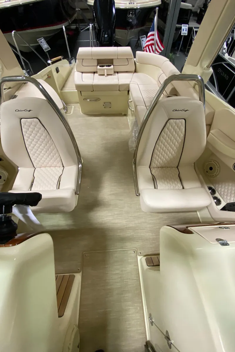 Slide: The Image of 2025 Chris-Craft Launch 28 GT boat bathroom interior with sink and toilet. - 18