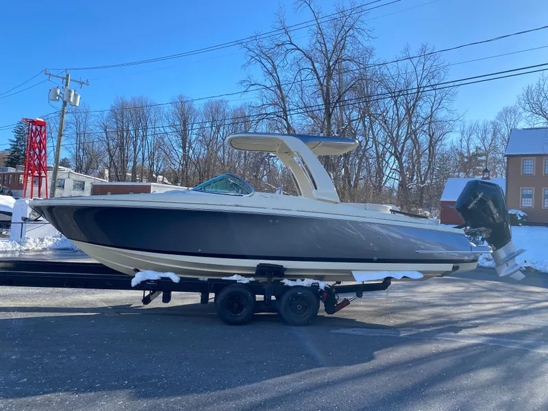 Slide: The Image of 2025 Chris-Craft Launch 28 GT boat on trailer at dealership. - 3